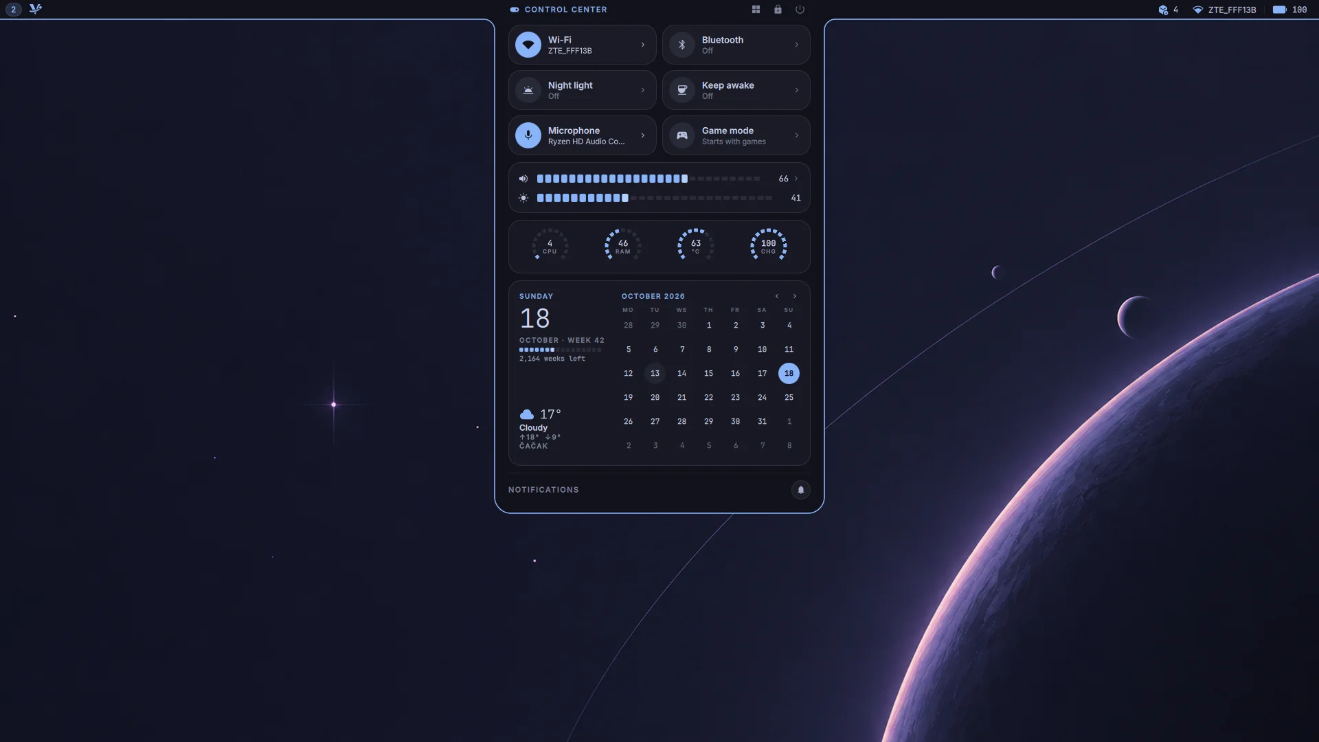 The Vyntaris desktop with the control center open under the island: quick tiles, volume, system gauges, a calendar with the weather